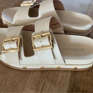 BCBGeneration Cream Slide Sandals with Gold Buckles